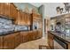The open concept kitchen features granite counters, stone backsplash, and stainless steel appliances at 41908 N Harbour Town Ct, Anthem, AZ 85086