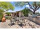 Outdoor patio featuring a built-in grill and comfortable seating, perfect for entertaining at 41908 N Harbour Town Ct, Anthem, AZ 85086