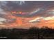 Beautiful sunset view showcasing vibrant colors over the desert landscape, enhancing the property's serene appeal at 41908 N Harbour Town Ct, Anthem, AZ 85086