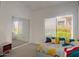 Bright bedroom with a large window, mirrored closet, and vibrant bedding at 4223 E Wildcat Dr, Cave Creek, AZ 85331