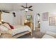 Cozy main bedroom with a four-poster bed, soft carpet, and ensuite bathroom at 4223 E Wildcat Dr, Cave Creek, AZ 85331