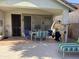 Covered patio with tile flooring, outdoor dining furniture, and comfortable seating perfect for outdoor living at 4223 E Wildcat Dr, Cave Creek, AZ 85331
