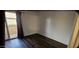 Clean and simple bedroom with neutral walls and sliding glass door to balcony at 4601 N 102Nd Ave # 2202, Phoenix, AZ 85037