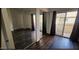 Bright bedroom featuring mirrored closet doors and a sliding glass door at 4601 N 102Nd Ave # 2202, Phoenix, AZ 85037