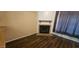 Inviting living room with classic fireplace and modern hardwood floors at 4601 N 102Nd Ave # 2202, Phoenix, AZ 85037