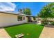 Backyard featuring artificial turf grass and a patio, perfect for outdoor entertainment and activities at 506 W Seldon Ln, Phoenix, AZ 85021