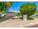 Lovely home featuring a two-car garage, manicured lawn, and welcoming curb appeal at 506 W Seldon Ln, Phoenix, AZ 85021