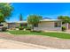Charming single-story home boasts fresh landscaping and a well-manicured lawn at 506 W Seldon Ln, Phoenix, AZ 85021