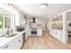 Open-concept kitchen featuring stainless appliances, modern cabinetry, and tile floors at 506 W Seldon Ln, Phoenix, AZ 85021