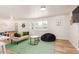 Spacious living room with a foosball table, comfortable seating, and a cozy atmosphere at 506 W Seldon Ln, Phoenix, AZ 85021