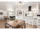 Spacious, open-concept living area with a modern light fixture, seamlessly connected to the kitchen and Gathering room at 506 W Seldon Ln, Phoenix, AZ 85021