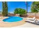 Inviting swimming pool with poolside lounge chairs, ideal for relaxation and enjoying the outdoors at 506 W Seldon Ln, Phoenix, AZ 85021