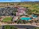 Expansive aerial view showcasing resort-style living, featuring a pool, bocce ball court, and community center amenities at 5312 S Citrus Ct, Gilbert, AZ 85298