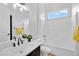 Bright, renovated bathroom features a tub, shower, and modern vanity at 5312 S Citrus Ct, Gilbert, AZ 85298