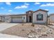 Charming single-story home with stone accents, desert landscaping, and a two-car garage at 5312 S Citrus Ct, Gilbert, AZ 85298