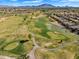 Beautiful aerial view of a golf course with well-maintained greens and scenic water features, perfect for a relaxing game at 5312 S Citrus Ct, Gilbert, AZ 85298