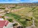 Scenic view overlooking the lush golf course, featuring well-manicured greens and a charming clubhouse in the distance at 5312 S Citrus Ct, Gilbert, AZ 85298