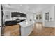 Kitchen with black cabinets, stainless steel appliances, and a breakfast bar at 5312 S Citrus Ct, Gilbert, AZ 85298