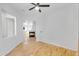 Open-concept living room features wood floors, open access to dining and fireplace at 5312 S Citrus Ct, Gilbert, AZ 85298