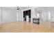 Spacious living room with a fireplace, built-in shelving, and hardwood floors at 5312 S Citrus Ct, Gilbert, AZ 85298