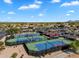 Aerial view of tennis courts and pickleball courts in a Primary-planned community at 5312 S Citrus Ct, Gilbert, AZ 85298