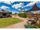 This backyard features a meticulously maintained yard and decorative water feature at 5601 W Whitten St, Chandler, AZ 85226
