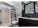 Updated bathroom with a modern vanity and shower with gray accents at 5601 W Whitten St, Chandler, AZ 85226