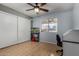The airy bedroom has wood floors, ample storage, and natural light at 5601 W Whitten St, Chandler, AZ 85226