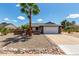 Charming single-Gathering home with a two-car garage and desert landscaping, including a tall palm tree at 5601 W Whitten St, Chandler, AZ 85226