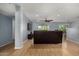 Bright living room featuring sleek hardwood floors, neutral walls, and a ceiling fan at 5601 W Whitten St, Chandler, AZ 85226