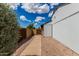 Clean side yard with a walkway, gated access, and low-maintenance gravel landscaping for easy upkeep at 5601 W Whitten St, Chandler, AZ 85226