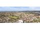 An aerial neighborhood view shows parks, green space and wide streets near the property at 630 W Navarro Ave, Mesa, AZ 85210