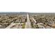 Wide aerial view shows the neighborhood's lush landscaping, and proximity to retail and parks at 630 W Navarro Ave, Mesa, AZ 85210