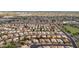 Expansive aerial view of a well-maintained residential neighborhood with lush landscaping and tree-lined streets at 630 W Navarro Ave, Mesa, AZ 85210