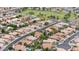 A high aerial shot shows the property in a neighborhood with trees, green space and walking distance to a park at 630 W Navarro Ave, Mesa, AZ 85210