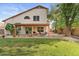 Lush backyard boasts covered patio, outdoor dining area, and a well-maintained lawn for entertaining at 630 W Navarro Ave, Mesa, AZ 85210