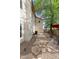 Gravel side yard featuring a patio area with outdoor seating, perfect for enjoying the outdoor space at 630 W Navarro Ave, Mesa, AZ 85210