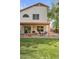 Spacious backyard featuring a covered patio, lush green grass, and plenty of room for entertaining at 630 W Navarro Ave, Mesa, AZ 85210