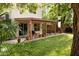 Spacious backyard with a covered patio, dining area, and well-maintained lawn at 630 W Navarro Ave, Mesa, AZ 85210