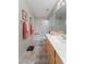 Bright bathroom featuring a vanity, shower-tub combo, and updated fixtures at 630 W Navarro Ave, Mesa, AZ 85210