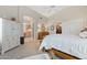 Spacious bedroom featuring a ceiling fan, ensuite bathroom, and access to the closet at 630 W Navarro Ave, Mesa, AZ 85210
