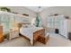 Bright bedroom with a vaulted ceiling, a ceiling fan, and ample natural light at 630 W Navarro Ave, Mesa, AZ 85210