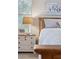 Comfortable bedroom with bedside table, lamp, Gathering photo, and an inspiring picture at 630 W Navarro Ave, Mesa, AZ 85210
