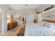 Large bedroom featuring a ceiling fan, natural light, and wood furniture at 630 W Navarro Ave, Mesa, AZ 85210