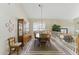 Traditional dining room with wood table, china cabinet, and natural light at 630 W Navarro Ave, Mesa, AZ 85210