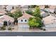 Charming two-story home with a tile roof, desert landscaping, and a two-car garage at 630 W Navarro Ave, Mesa, AZ 85210