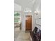 Welcoming foyer with high ceilings, wood flooring, and a view into the adjacent living area at 630 W Navarro Ave, Mesa, AZ 85210