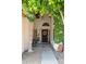 Inviting entryway with a decorative wreath, lush greenery and cozy decor at 630 W Navarro Ave, Mesa, AZ 85210