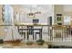 Bright kitchen featuring white cabinetry, modern appliances, and an open view from the living space at 630 W Navarro Ave, Mesa, AZ 85210
