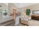 Inviting living space with stairway, a dining area, and a decorative piano at 630 W Navarro Ave, Mesa, AZ 85210